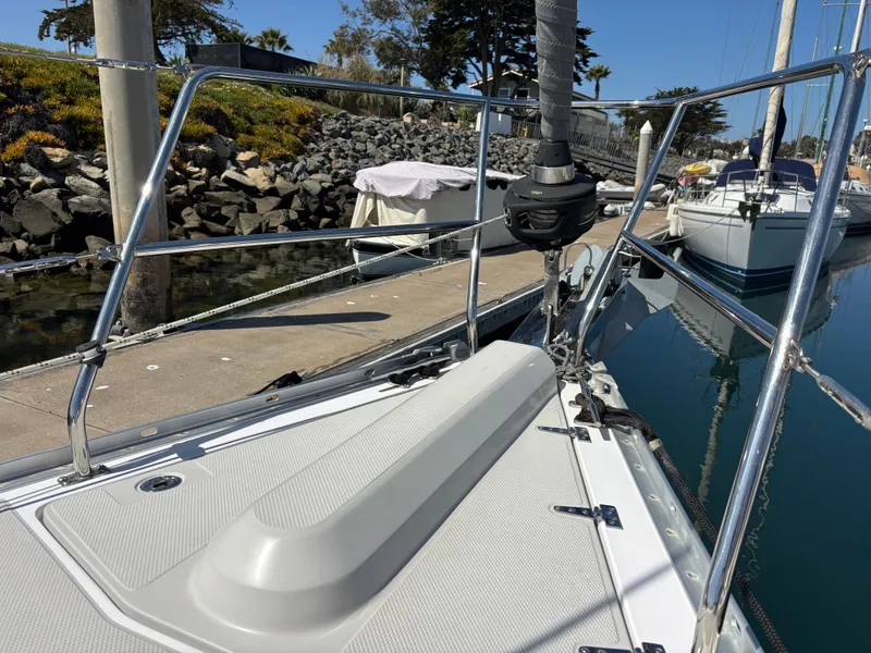 2019 Catalina 385 sailboat docked, showcasing deck and railing details.