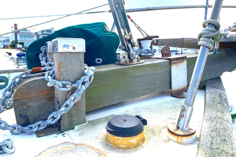 Deck of 1980 Tayana Pilot House sailboat with chains and ropes.