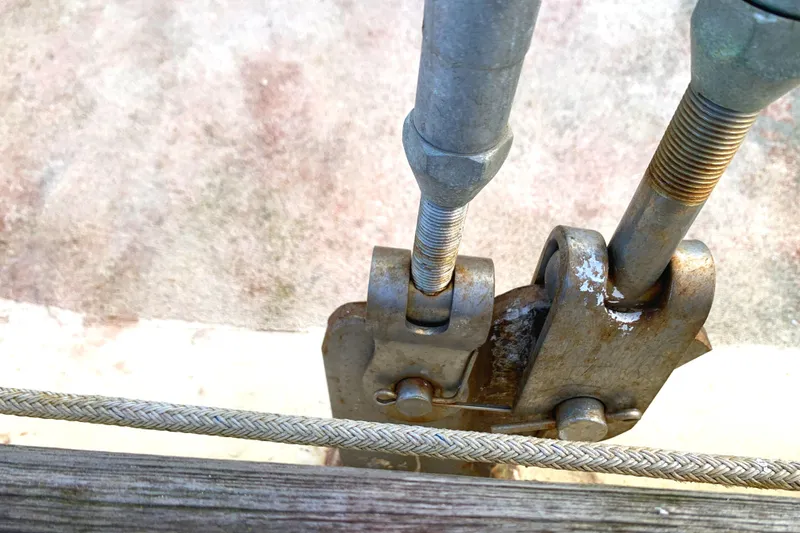Close-up of Tayana Pilot House 1980 sailboat rigging and turnbuckle mechanism.