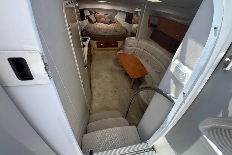 Interior of 2003 Formula 37 Performance Cruiser with cozy seating and sleeping area.