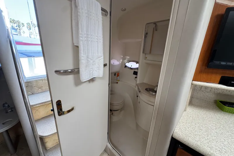 Interior of 2003 Formula 37 Performance Cruiser bathroom with compact design and amenities.