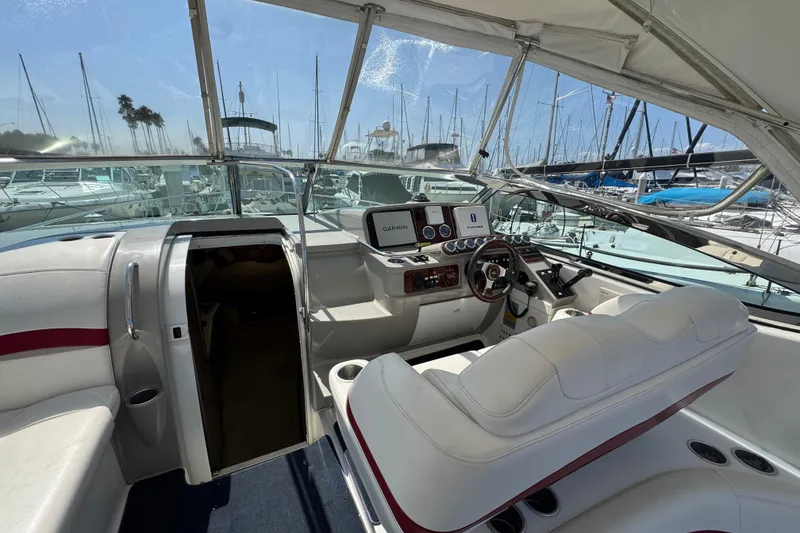 2003 Formula 37 Performance Cruiser cockpit with modern navigation equipment and luxurious seating.