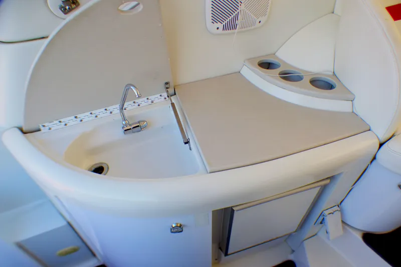 2003 Formula 37 PC yacht kitchenette with sink, counter, and cup holders.