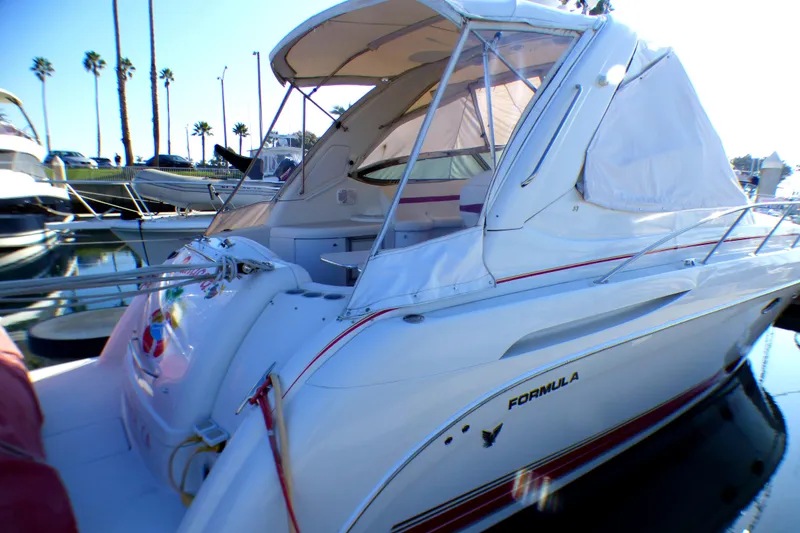 2003 Formula 37 PC yacht docked at marina, featuring sleek design and white exterior.