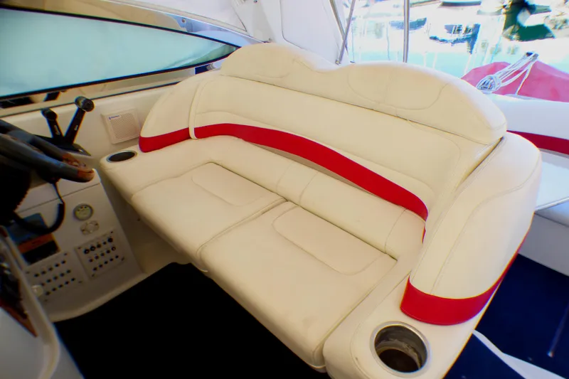 2003 Formula 37 PC boat interior with white and red cushioned seating.