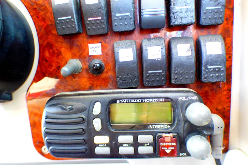 Control panel of a 2003 Formula 37 PC boat with radio and switches.