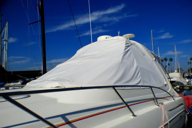 2003 Formula 37 PC yacht covered at marina under clear blue sky.