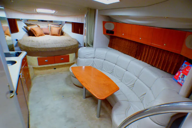 Luxurious interior of a 2003 Formula 37 PC yacht with cozy seating and elegant decor.