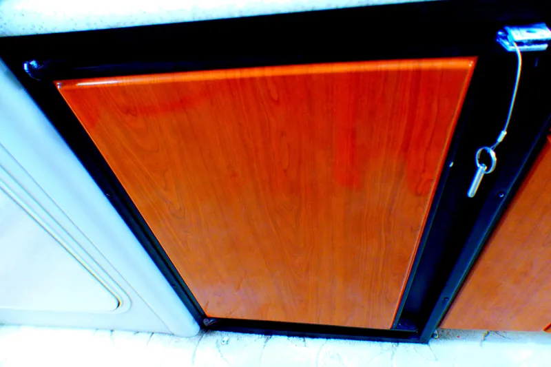 2003 Formula 37 PC wooden cabinet with key, interior detail.