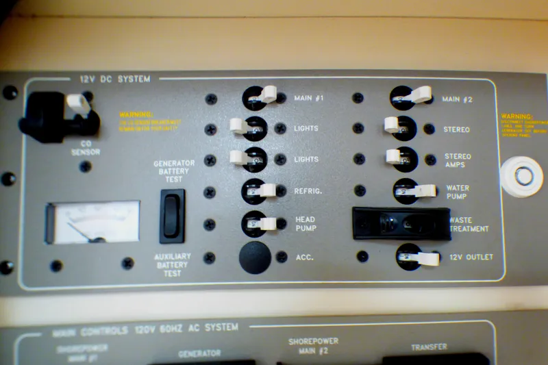 Control panel of a 2003 Formula 37 PC boat, featuring various switches and gauges.