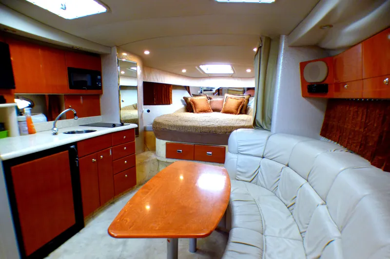 Luxurious interior of a 2003 Formula 37 PC yacht with modern amenities and cozy seating.