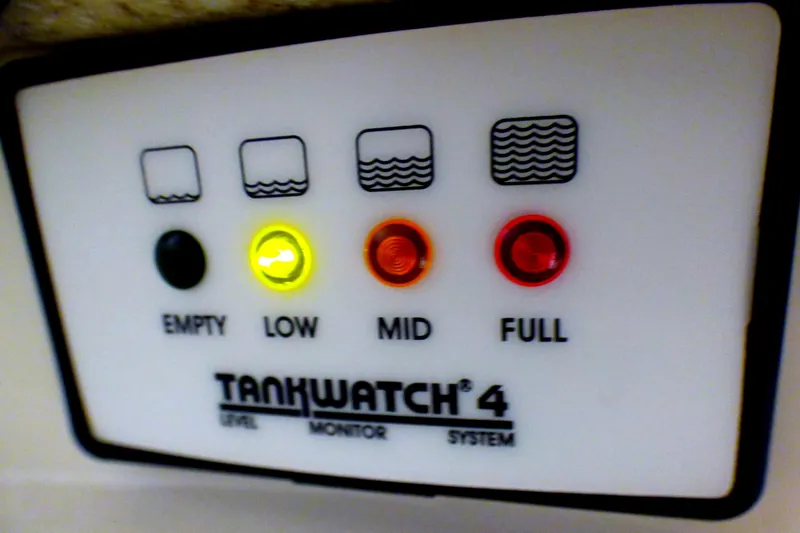 TankWatch 4 level monitor system with indicator lights for empty, low, mid, and full levels.
