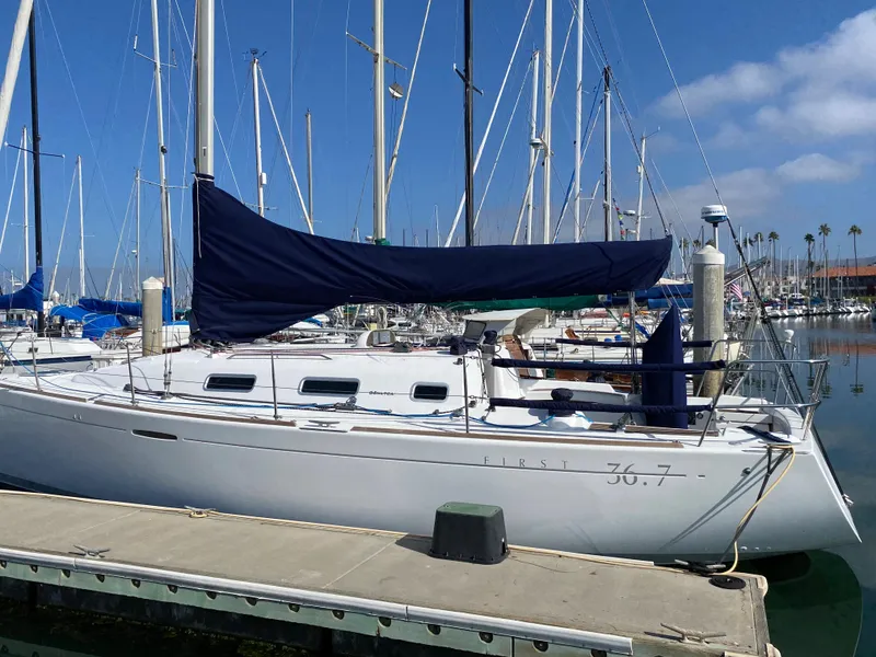 2004 Beneteau 36.7 sailboat docked at marina on a sunny day.