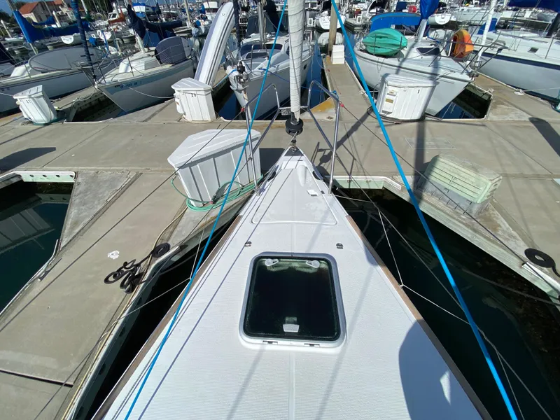 2004 Beneteau 36.7 sailboat docked at a marina, view of the bow.