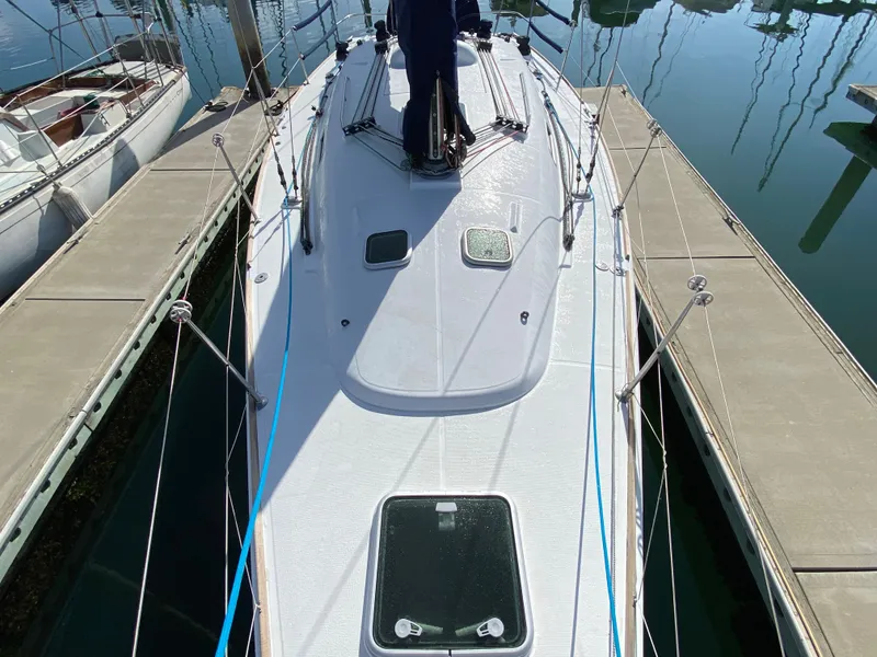 2004 Beneteau 36.7 sailboat docked at marina, top deck view.
