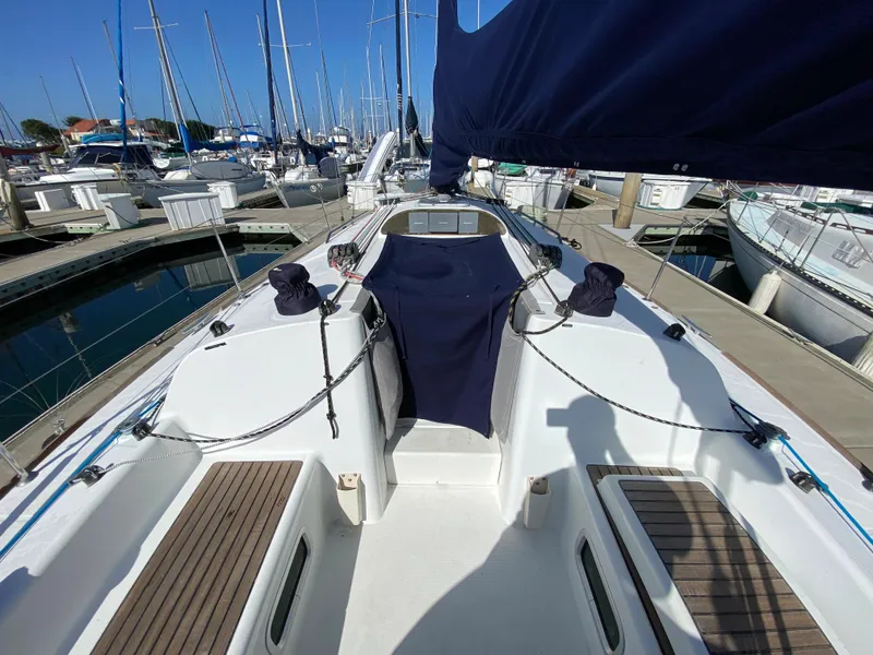 2004 Beneteau 36.7 sailboat docked at marina, view of cockpit and deck.