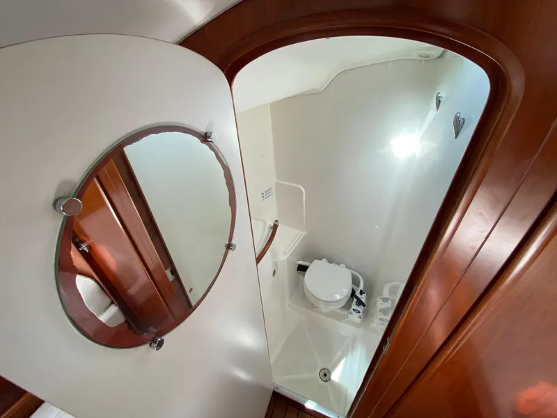 Beneteau 36.7 2004 yacht bathroom with mirror and toilet.