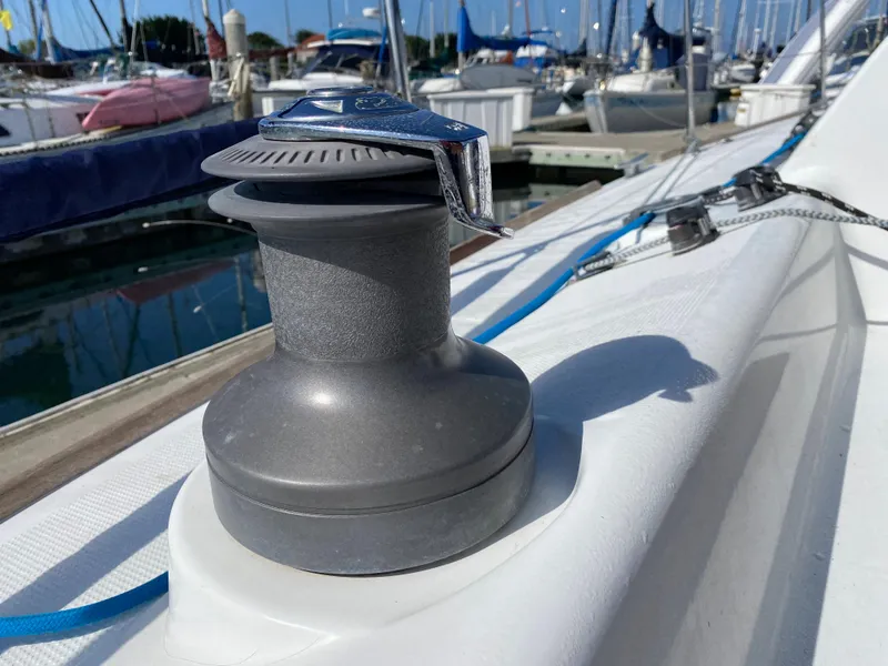 Close-up of a 2004 Beneteau 36.7 sailboat winch at a marina.