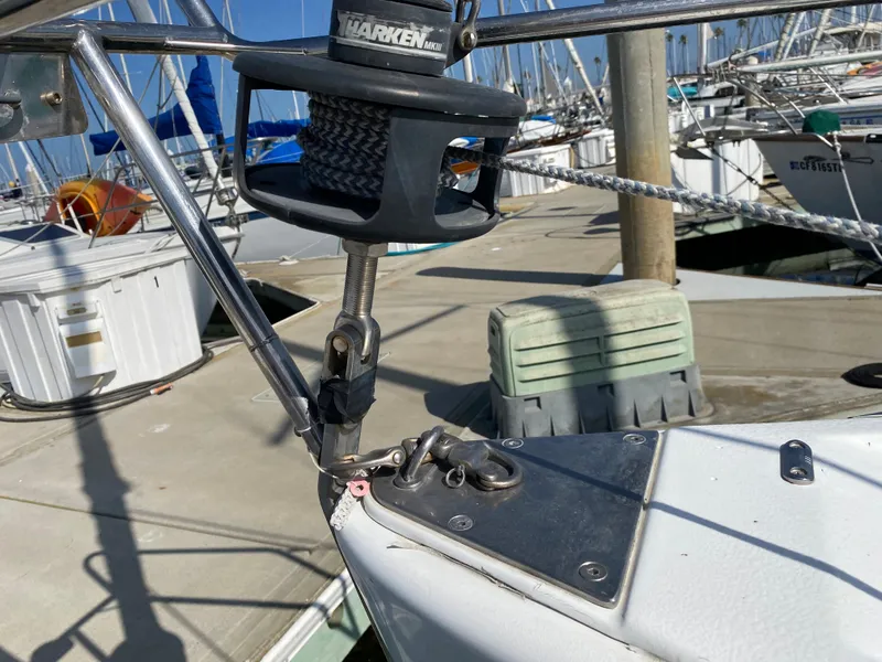 Close-up of a 2004 Beneteau 36.7 sailboat's bow and rigging at a marina.