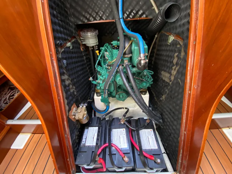 Engine compartment of a 2004 Beneteau 36.7 sailboat with batteries and wiring.