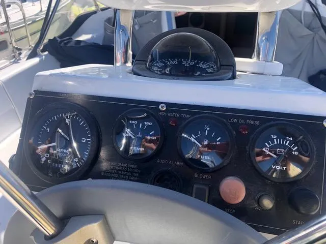 Control panel of a 2008 Catalina 320 MkII sailboat with gauges and compass.