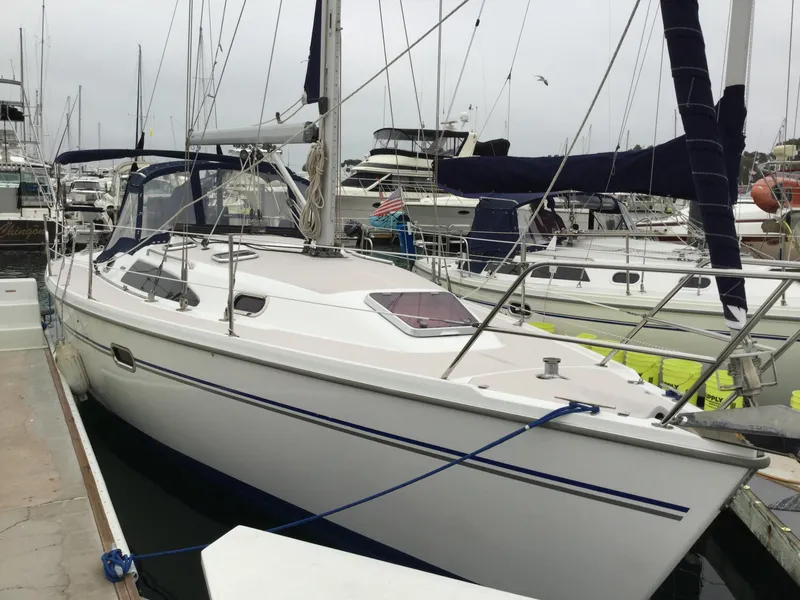 2008 Catalina 320 MkII sailboat docked in a marina, featuring sleek design and white hull.