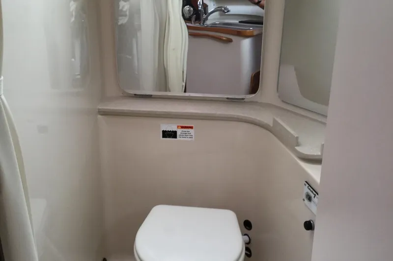 2008 Catalina 320 MkII yacht bathroom with toilet and mirror.