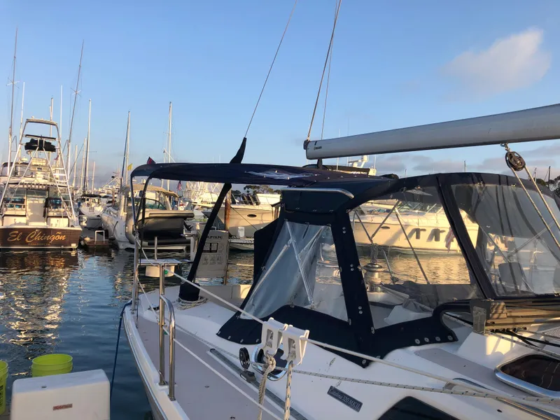 2008 Catalina 320 MkII sailboat docked in a marina, surrounded by other boats.