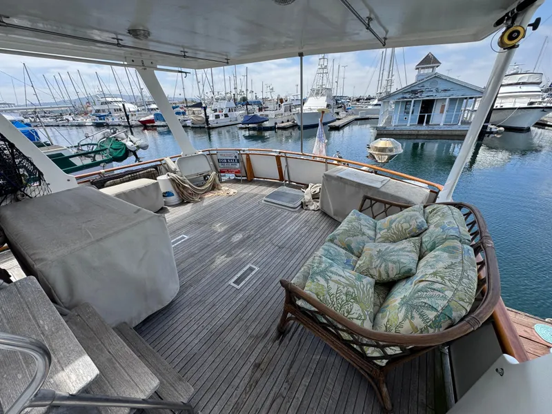 1984 Spindrift 39 ft. aft cabin yacht with spacious deck and marina view.