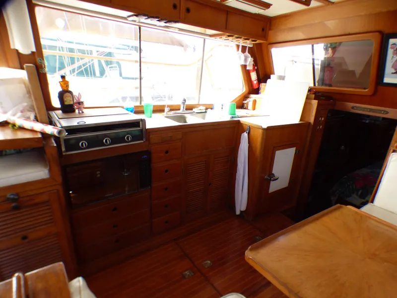 1984 Spindrift 39 ft. Aft Cabin interior with wooden cabinetry and kitchen area.