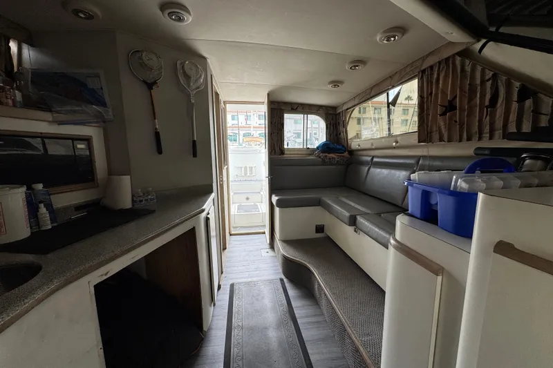 Interior of a 1993 Blackfin Sportfisher boat with seating and fishing gear.