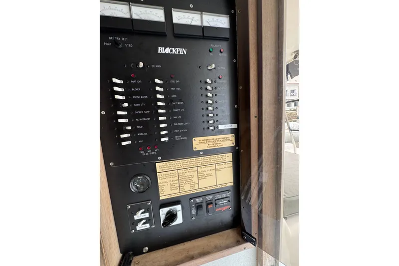 1993 Blackfin Sportfisher control panel with switches and gauges.