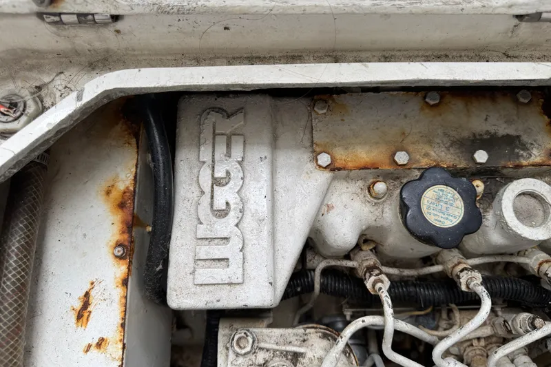 1993 Blackfin Sportfisher engine detail with visible rust and wear.
