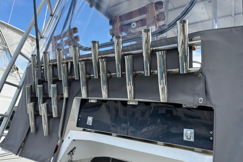 1993 Blackfin Sportfisher boat with multiple stainless steel rod holders on deck.