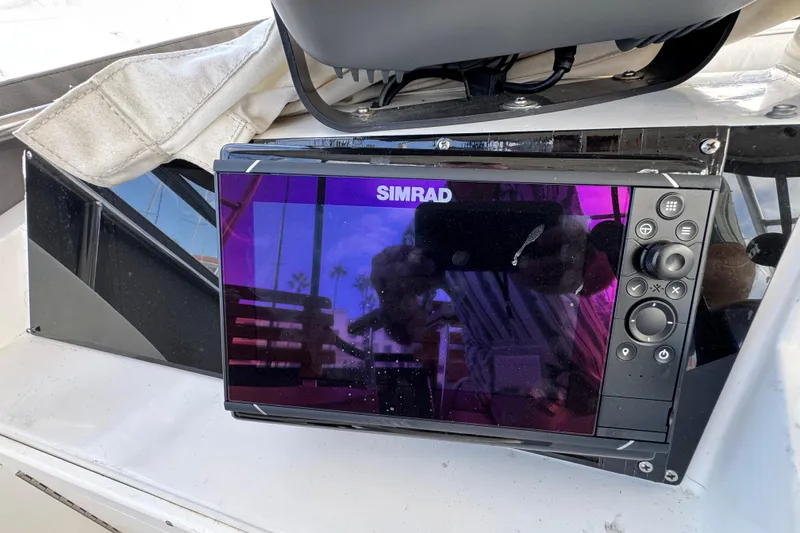 Simrad marine display on 1993 Blackfin Sportfisher boat dashboard.