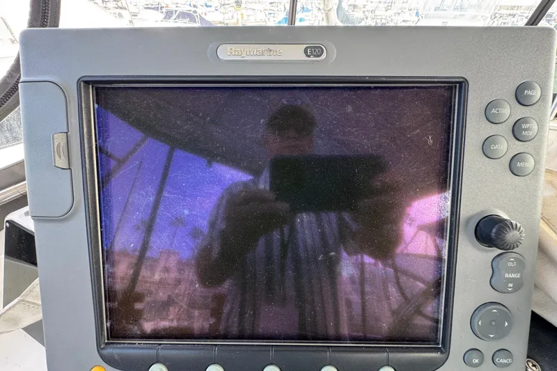 Raymarine E120 display on 1993 Blackfin Sportfisher boat, showing reflection.