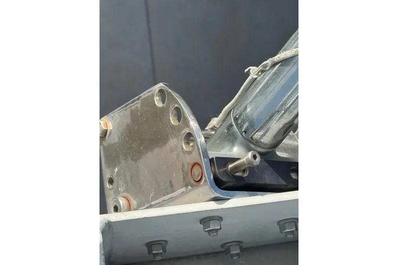 Close-up of a 1993 Blackfin Sportfisher boat component with metal bolts and fittings.