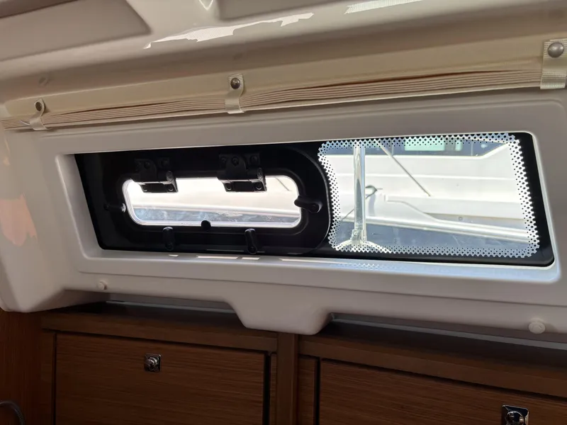 Interior view of a 2020 Bavaria Cruiser 34 yacht window and cabinetry.