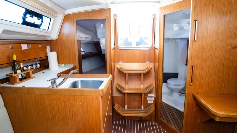 Interior of 2020 Bavaria Cruiser 34 yacht with kitchen and bathroom.