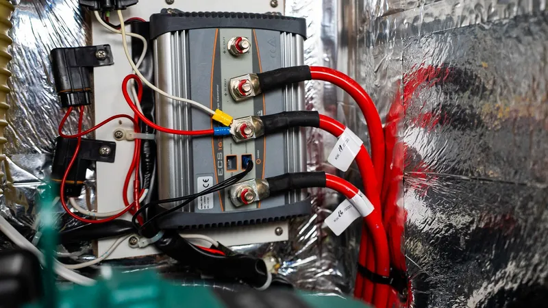 Electrical system of a 2020 Bavaria Cruiser 34 yacht with red and black cables.