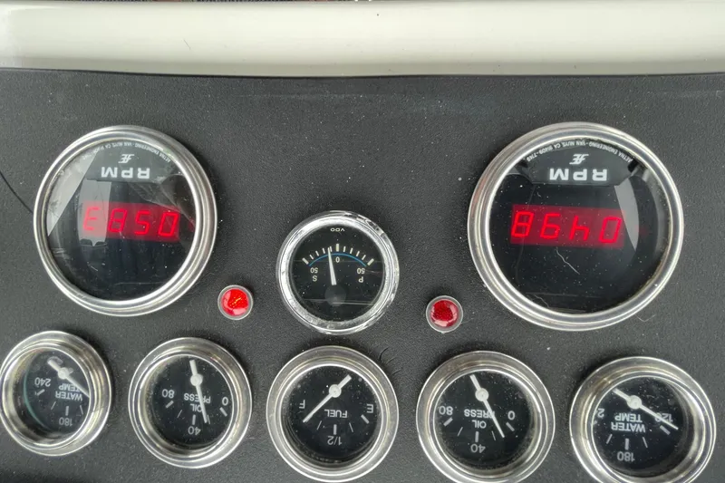 1975 Uniflite Sport Fisher 42 dashboard with RPM, oil, and temperature gauges.
