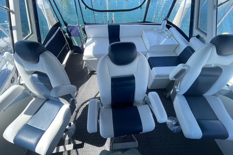 Interior of 1975 Uniflite Sport Fisher 42 with modern seating and ocean view.
