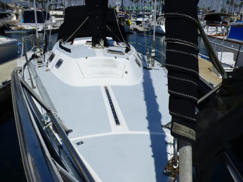 1982 Catalina 38 sailboat docked at marina, showcasing deck and rigging.