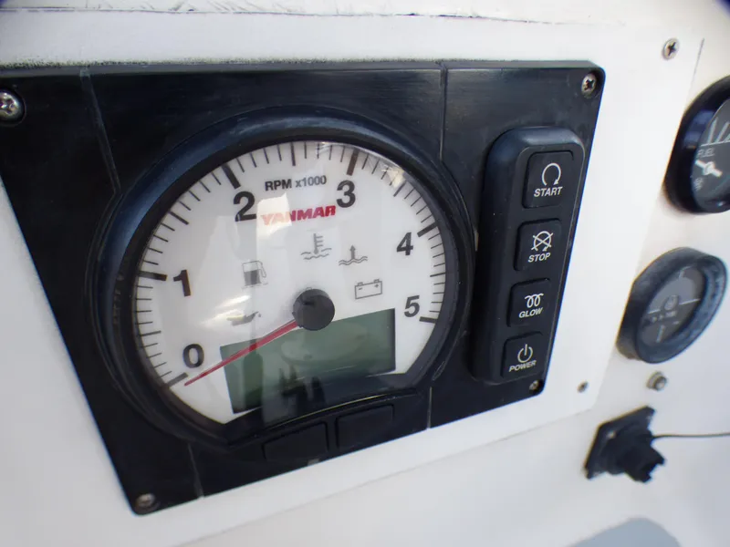Yanmar RPM gauge and controls on a 1982 Catalina 38 sailboat.