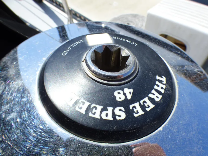 Close-up of a Lewmar three-speed winch on a 1982 Catalina 38 sailboat.
