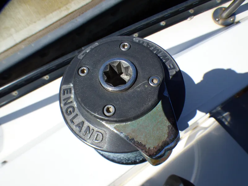 Winch on 1982 Catalina 38 sailboat deck, marked "England," used for sail handling.