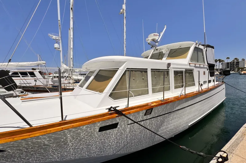 1978 Roughwater 41 yacht docked at marina under clear blue sky.