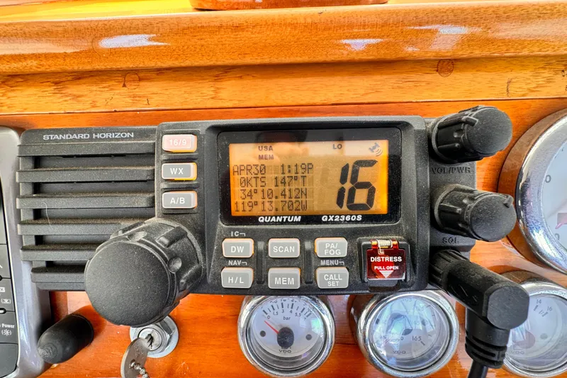 Standard Horizon radio on 1978 Roughwater 41 boat dashboard, displaying channel 16.
