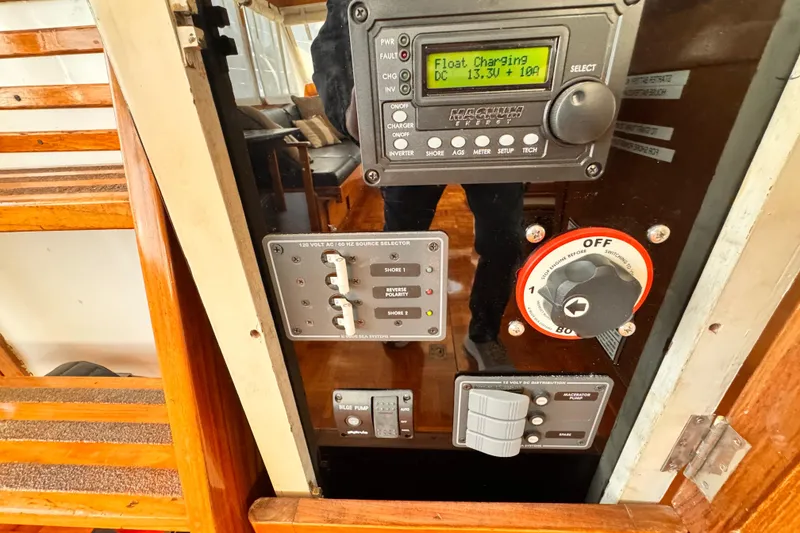 Control panel of a 1978 Roughwater 41 boat, featuring various switches and gauges.