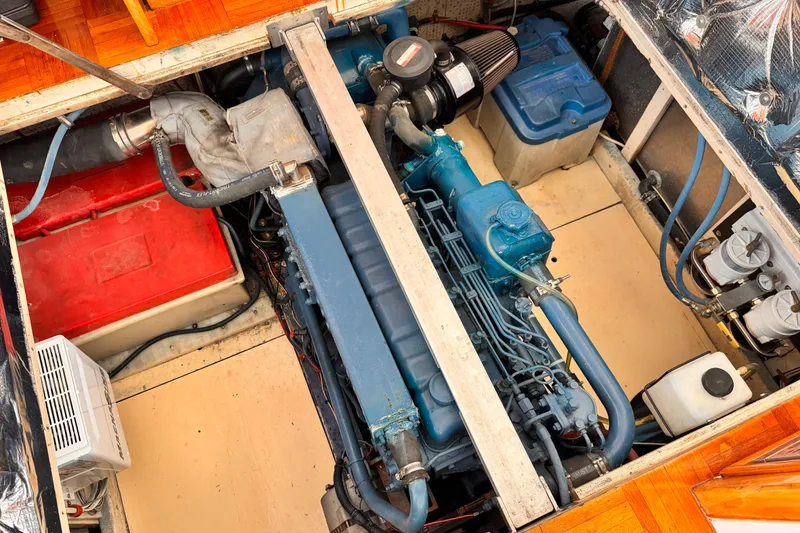 Engine compartment of a 1978 Roughwater 41 boat, showcasing a blue marine engine.